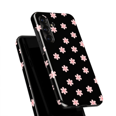 A black smartphone case with a pattern of pink flowers on it.