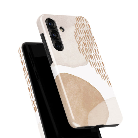 a phone case with a beige and white abstract design, including a pattern of circles and lines.