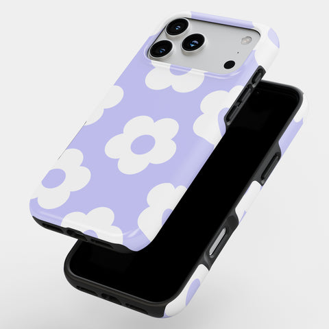A purple and white phone case with a flower pattern, featuring a camera and flash on the back.