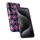 a smartphone case with a pink heart pattern on a black background.