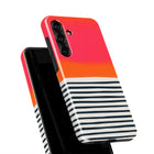 a colorful phone case with a striped pattern in shades of orange, black, and white.