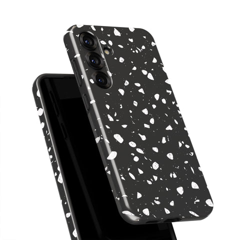 a black phone case with a white speckled pattern.