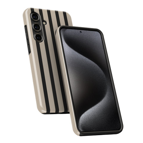 a smartphone with a black and white striped pattern on its case.