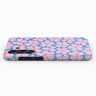 A phone case with a floral pattern in shades of blue and pink.