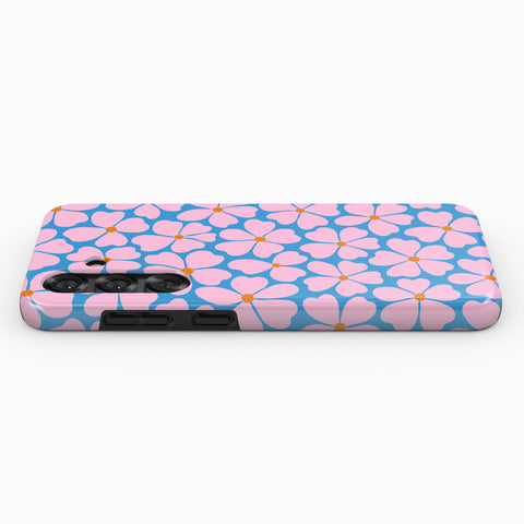 A phone case with a floral pattern in shades of blue and pink.