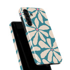 a phone case with a floral pattern in shades of blue and white.