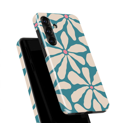a phone case with a floral pattern in shades of blue and white.