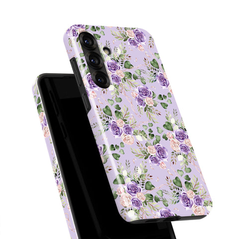 a phone case with a floral pattern in shades of purple and pink.