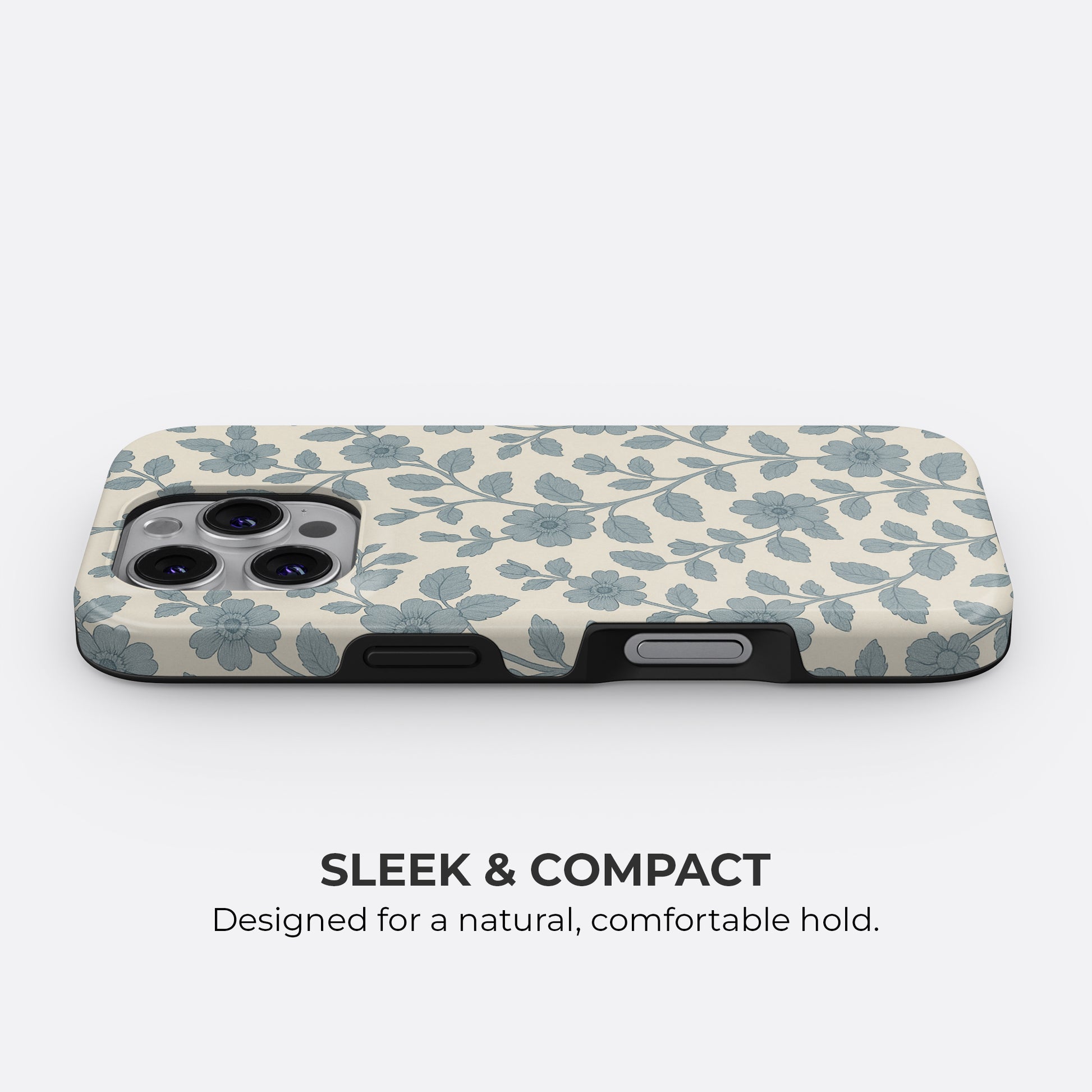 Slim and compact blue floral and leaf pattern iPhone tough case on cream background with sleek profile for a comfortable hold by HaloCovers