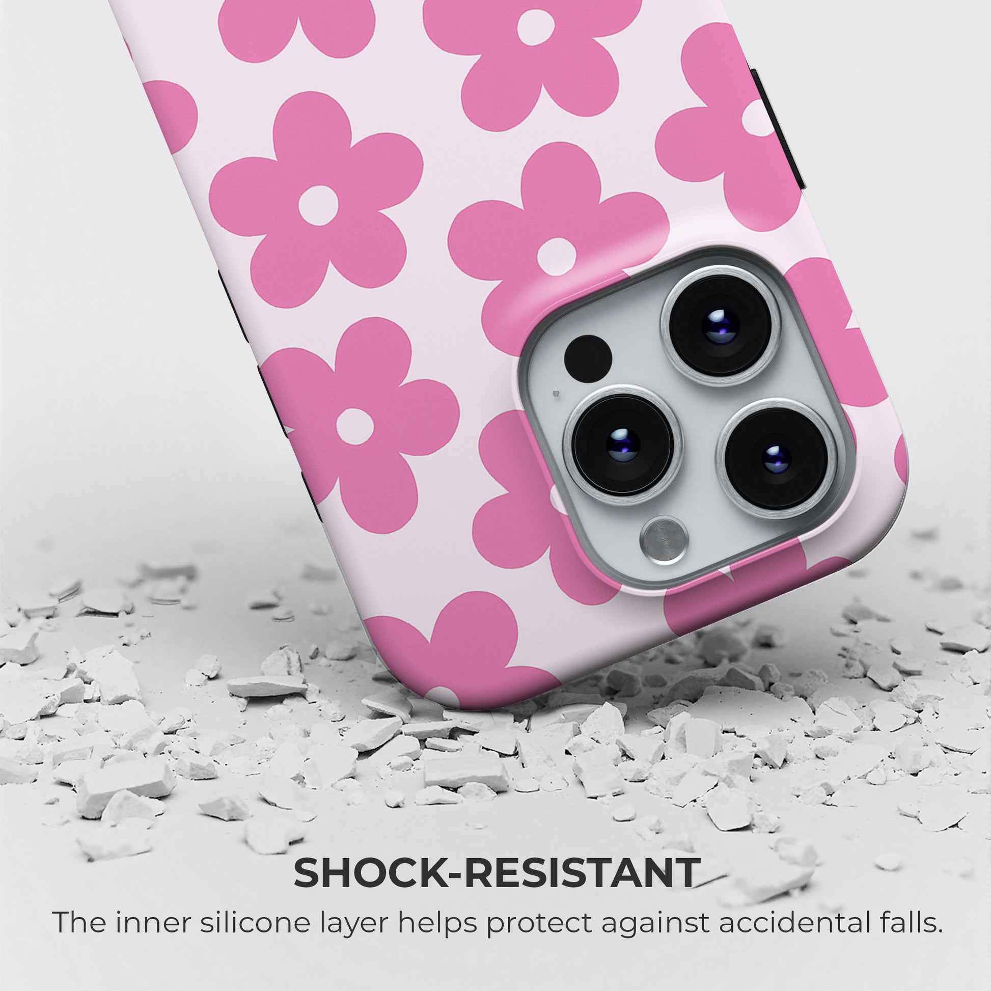 Pink daisy floral phone case with white and pink design, featuring shock-resistant silicone inner layer for drop protection by Casiden