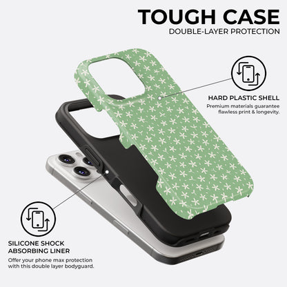 Tiny white flower tough phone case showing double-layer design with hard plastic shell and silicone shock-absorbing liner by HaloCovers